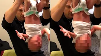 Tehnica socanta aplicata unui bebelus de 2 saptamani! Ce se intampla cu micutul cand e tinut doar de picioare, cu capul in jos! VIDEO alarmant
