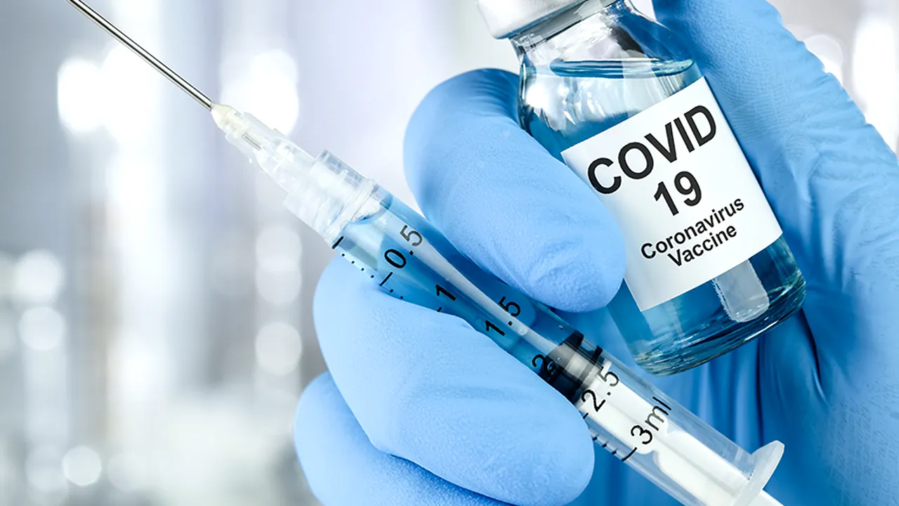 Healthcare cure concept with a hand in blue medical gloves holdi 