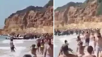 Turistii au avut un soc, chiar cand se relaxau pe o plaja de lux! Au fost invadati in cateva secunde de zeci de imigranti speriati. Imaginile VIDEO sunt virale