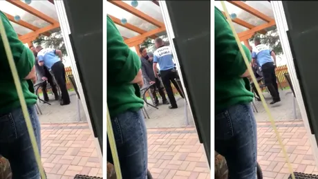 Un politist local din Timis loveste cu capul in gura un om al strazii! Imaginile scandaloase il vor costa scump pe agent! VIDEO